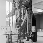 Black and white photograph of a V2 rocket on display as part of an exhibition