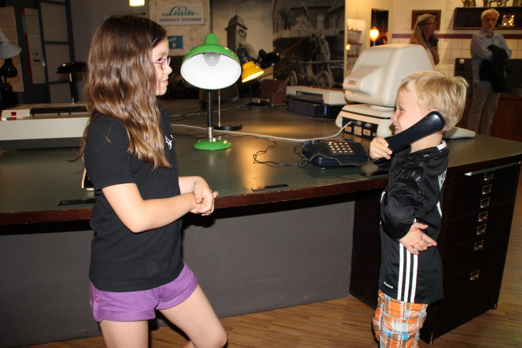Colour photograph of two young children volunteering as guides at the museum