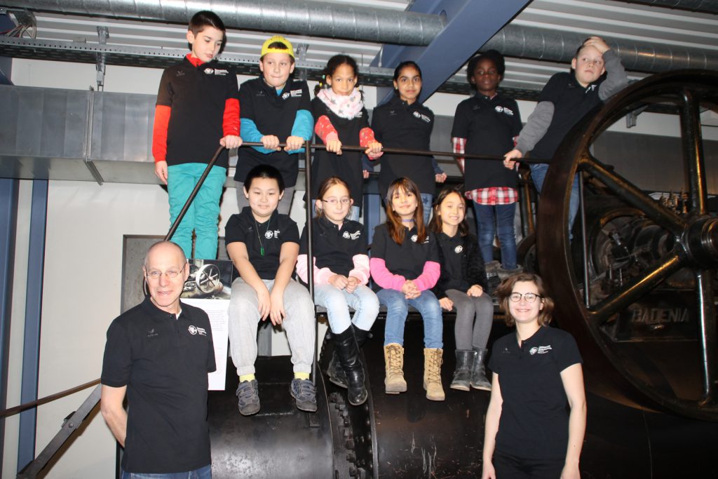 Colour photograph of the team of young participants in museum shirts