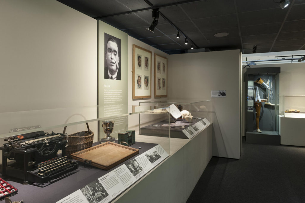Colour photograph of a gallery view of Wounded exhibition object displays