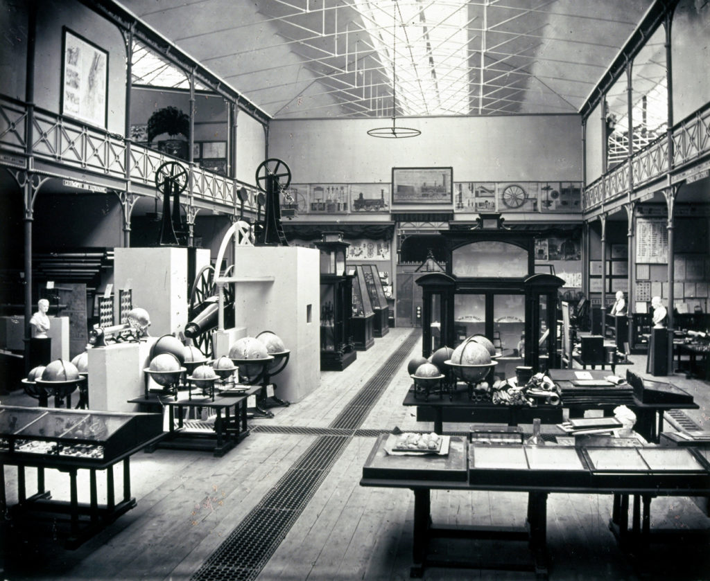 Black and white photograph of the Education Collection at the South Kensington Museum including the Transit Circle