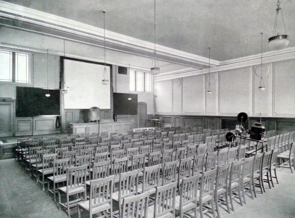 Black and white photograph of a lecture hall at the Royal Society of Medicine in 1912