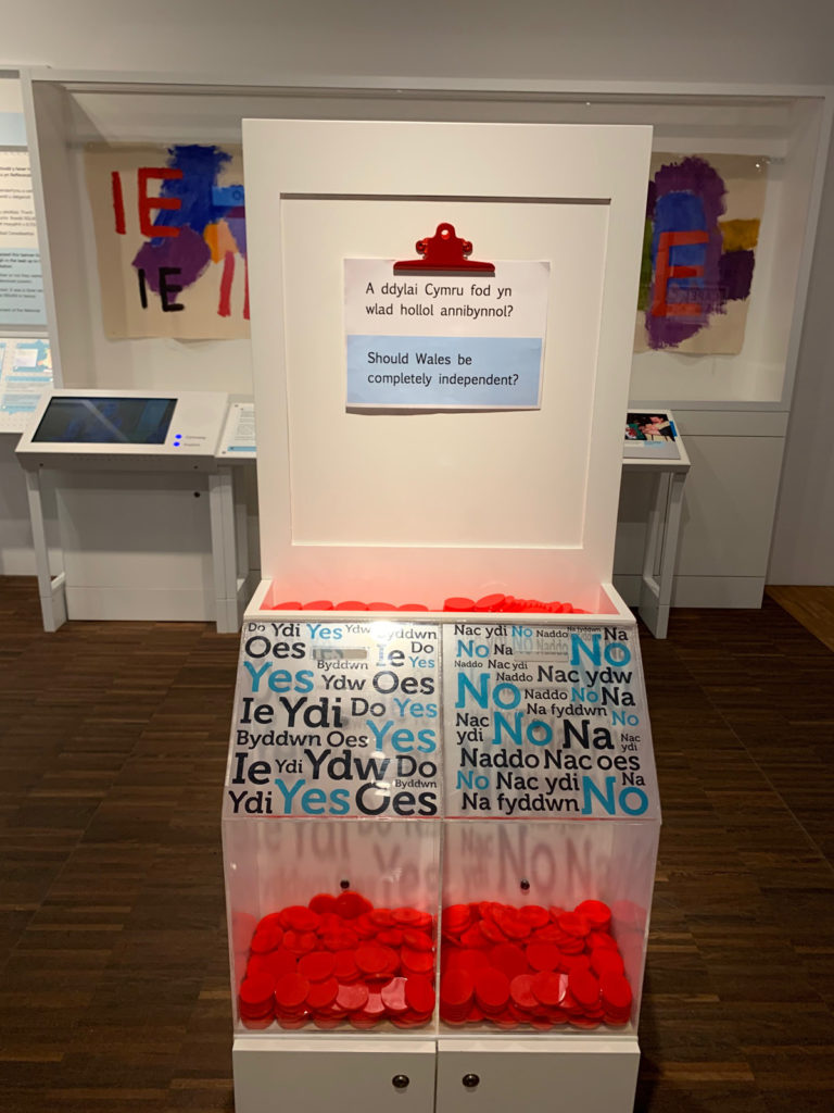 Colour photograph of a token bin in the Wales Is exhibition gallery