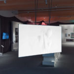 Gallery view of the Jo Spence exhibition showing a large video screen