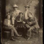 Sepia photograph of an amateur Yiddish theater acting troupe in 1900
