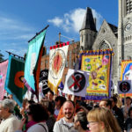 A group of protesters hold colourful banners in support of repealing irish abortion law