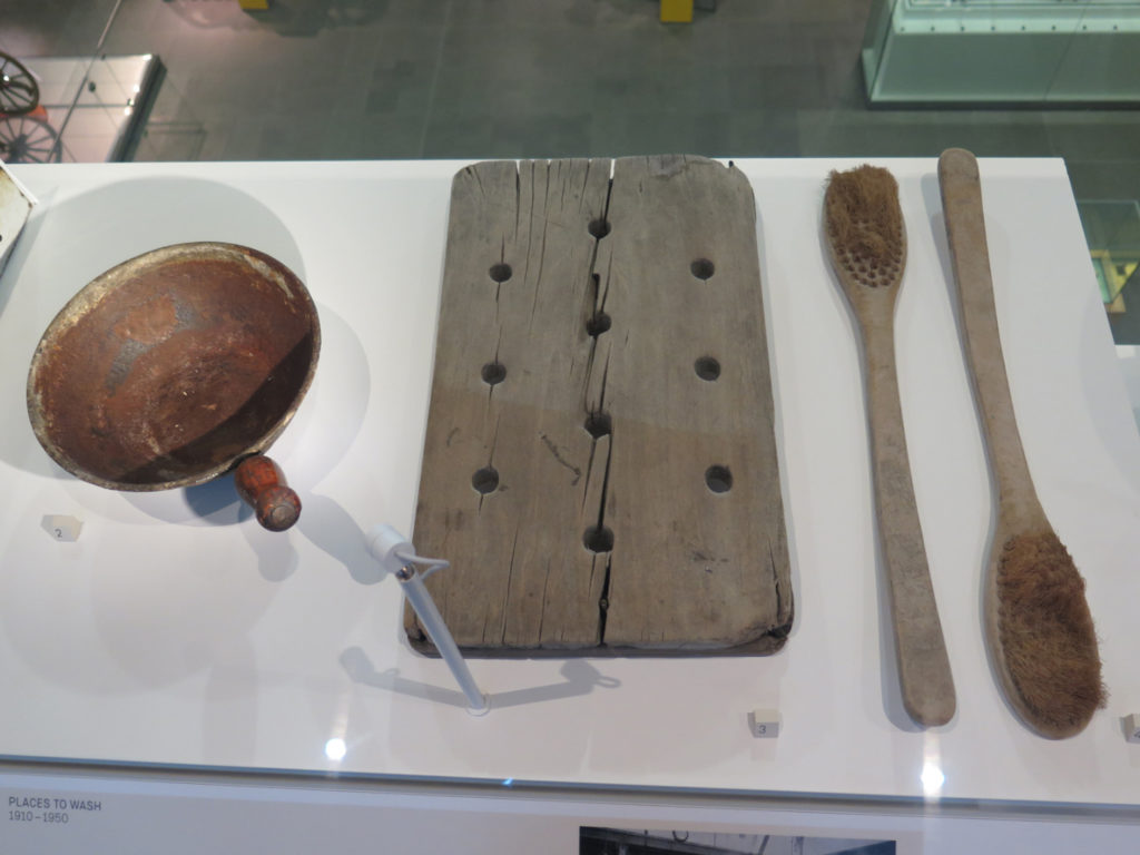 Colour photograph of historical bathing implements on display