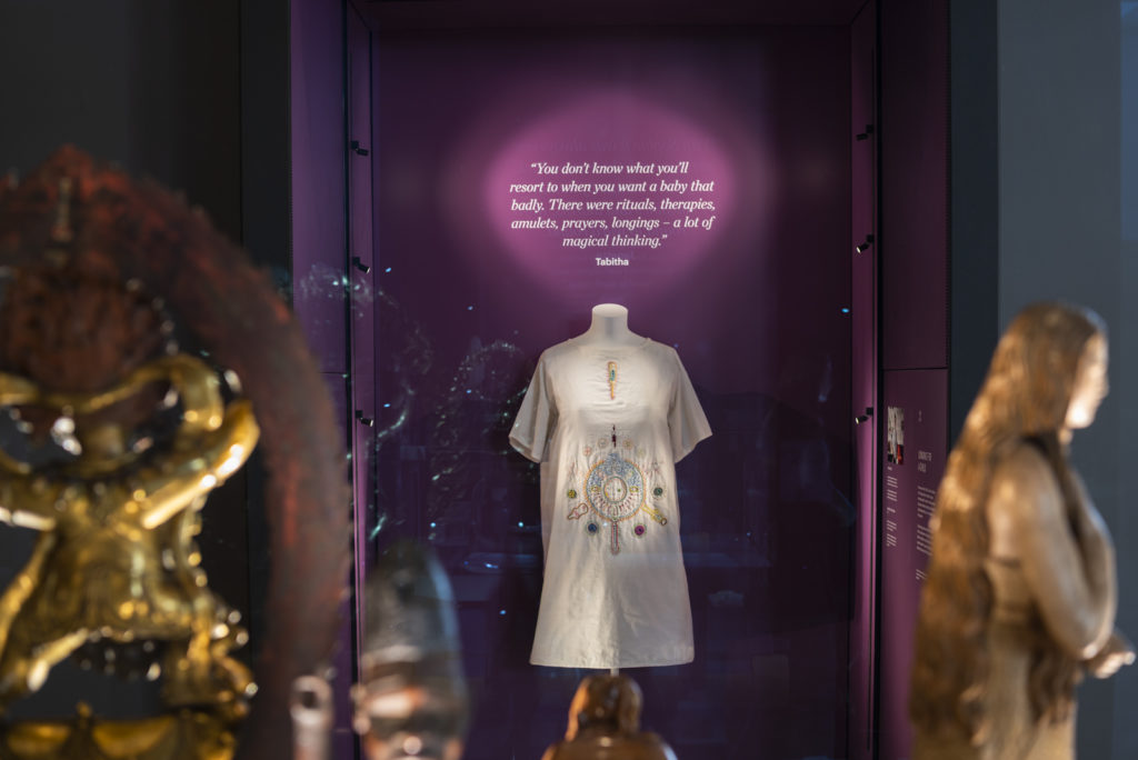 Colour photograph of a fertility dress on display in the Medicine Galleries