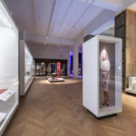 Colour photograph of a gallery view of the Medicine exhibition including a Sian Davey portrait