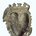 A lead alloy badge love token in the form of a crowned heart with scroll reading heart be true