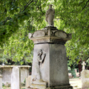 Colour photograph of an ornate tombstone for James Lowe