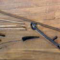 Colour photograph of stick objects to be used on the museum machinery demonstrations