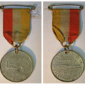 Colour photographs of an alloy commemorative medallion