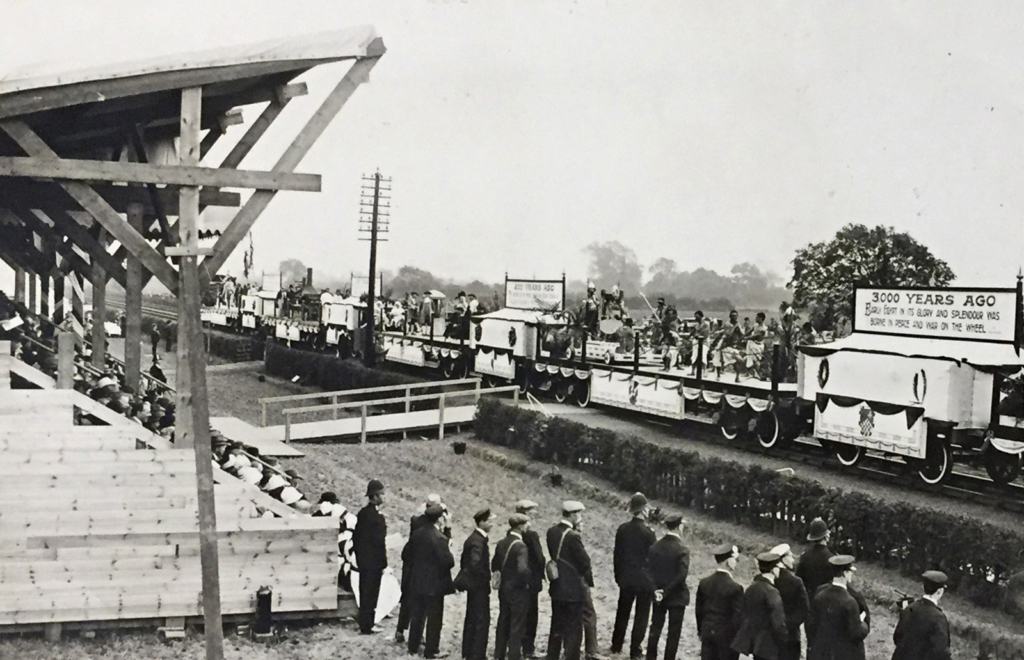 Black and white photograph of a historic tableaux in a steam engine cavalcade in 1925