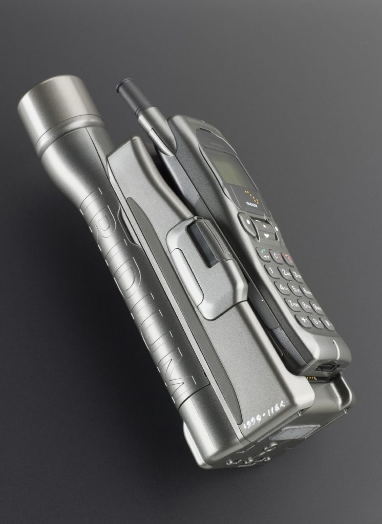 Colour photograph of an early mobile and satellite phone
