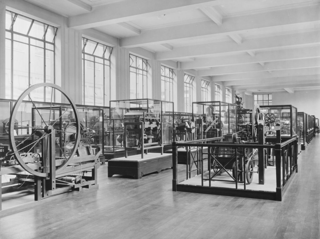 Monochrome photograph of textile machinery exhibition in 1927