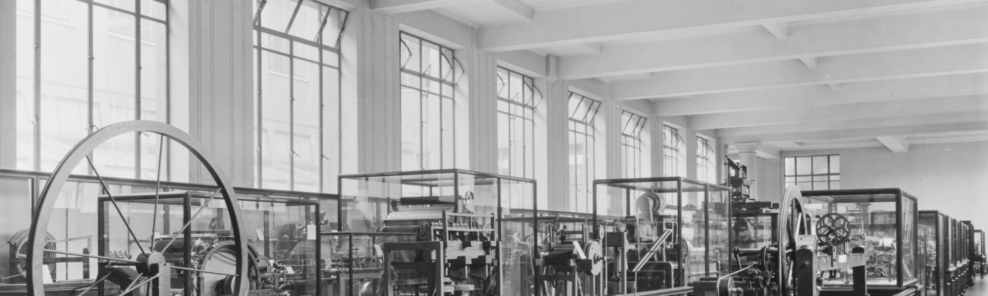 Monochrome photograph of textile machinery exhibition in 1927