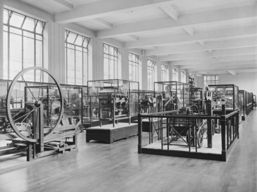 Monochrome photograph of textile machinery exhibition in 1927