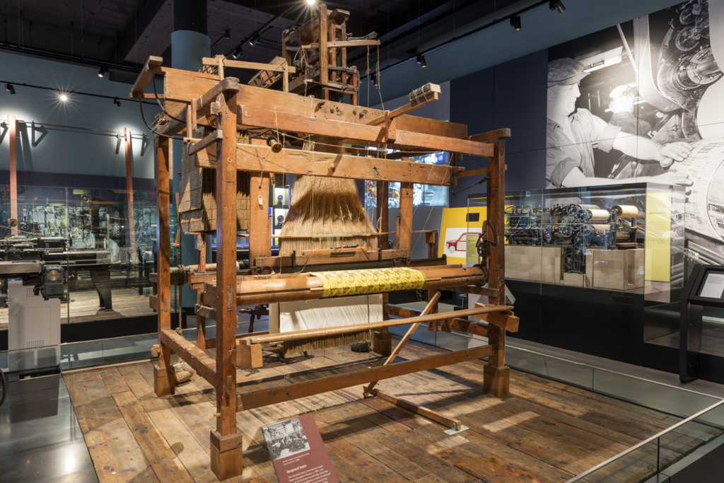 Colour photograph of a Jacquard loom on display at the National Museum of Scotland