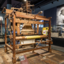 Colour photograph of a Jacquard loom on display at the National Museum of Scotland