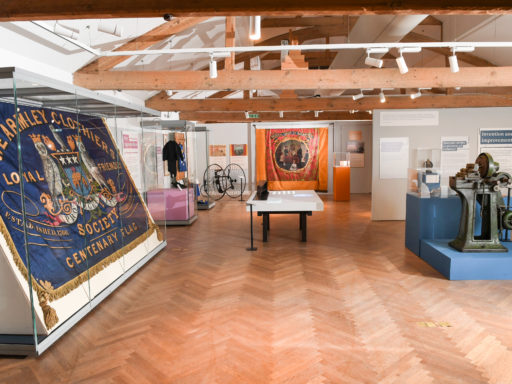 Photograph of a museum exhibit showing the Armley banner