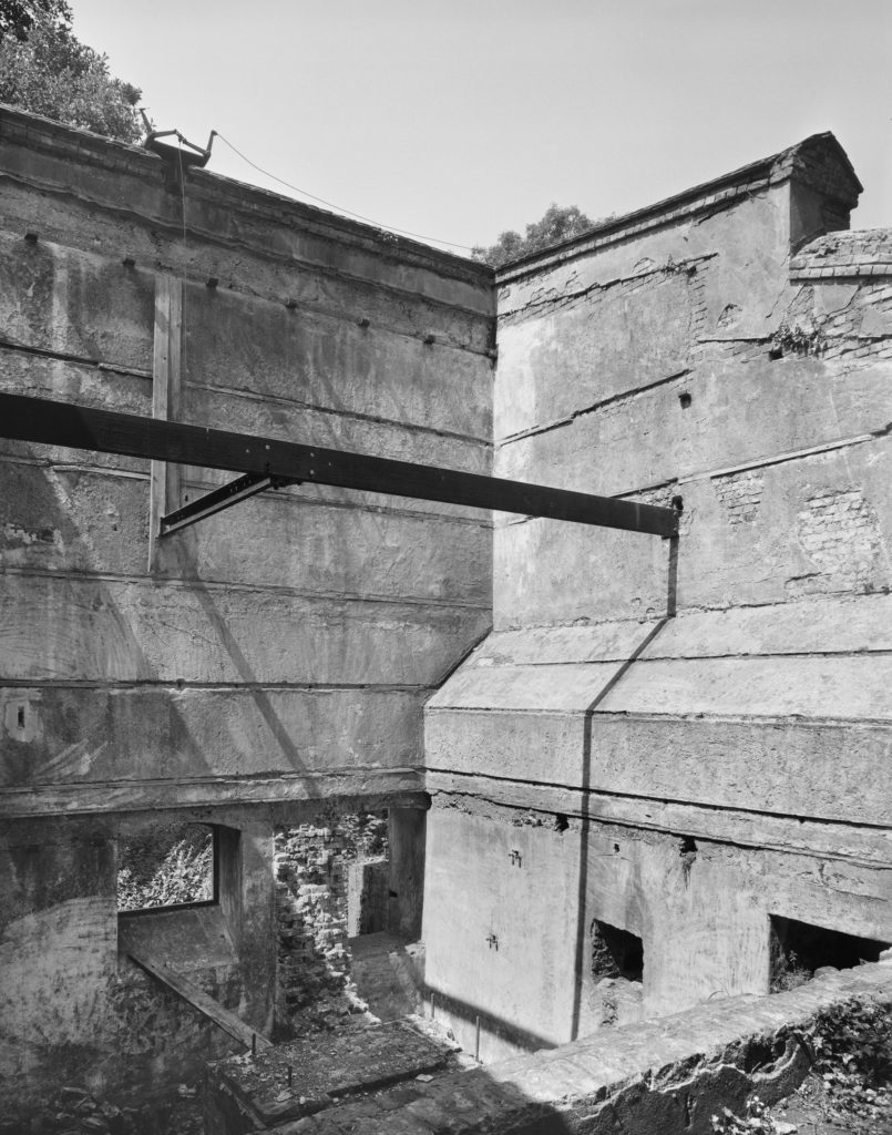 Black and white photograph of a ruined gunpowder incorporating mill showing a rolled steel joist