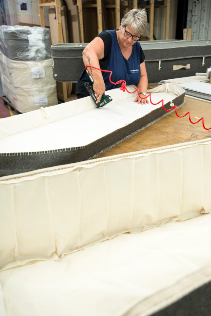Photograph of a woman making a biodegradable coffins