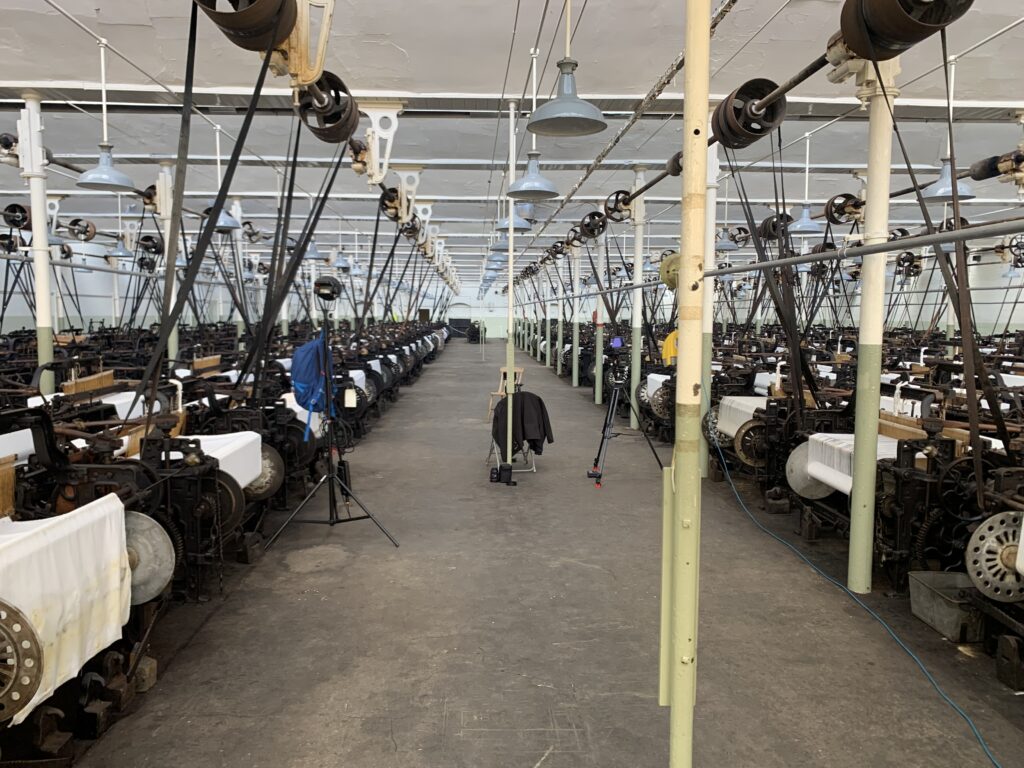 Interior view of Queen Street Mill showing many preserved looms