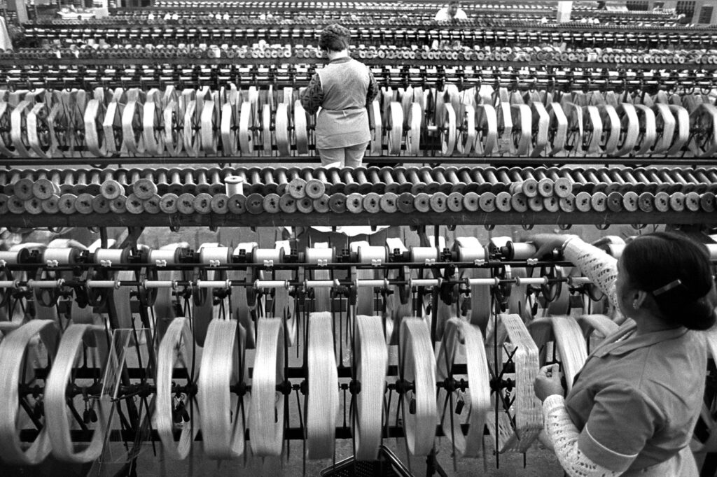 Photograph of workers spinning silk at Listers Bingley Mills in 1989
