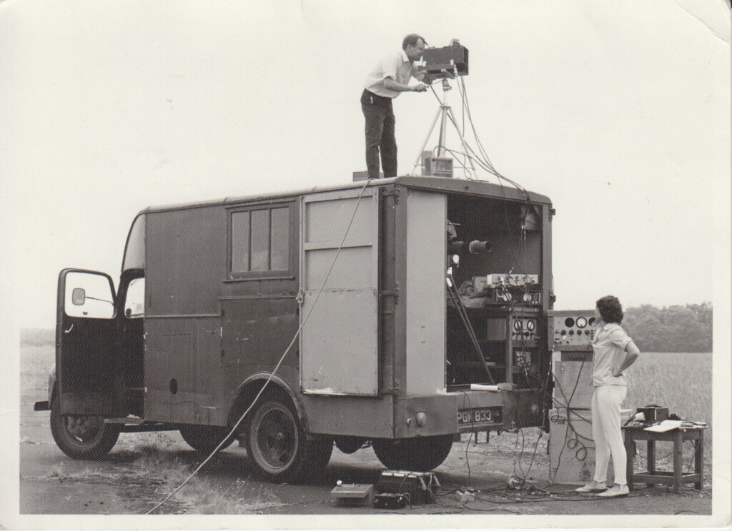 Black and white photograph of Shirley Jenkins and another member of the RAE infrared group operating the trials vehicle in 1970s