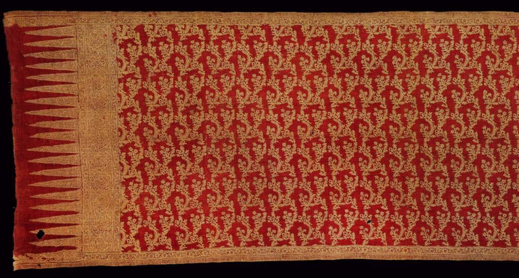 Colour photograph of a cotton skirt or shoulder cloth made on the Coromandel Coast for the Indonesian market