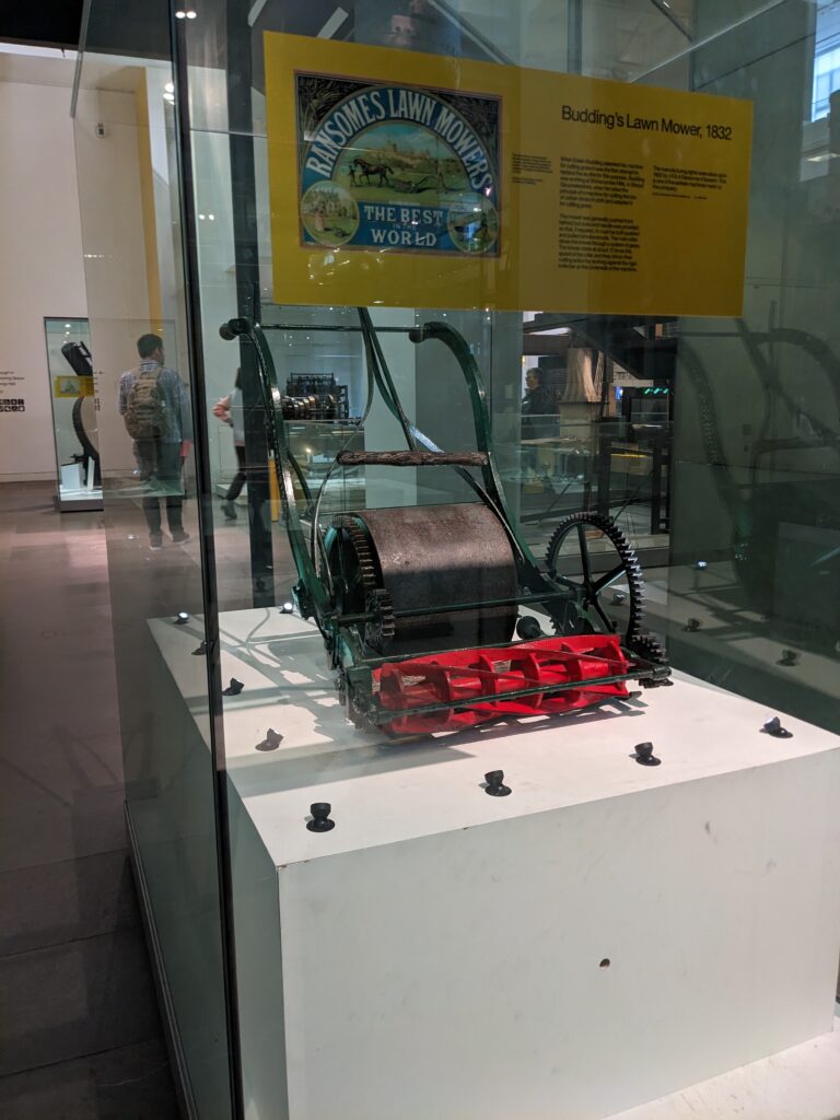 Colour photograph of Buddings Lawnmower on display at the Science Museum London