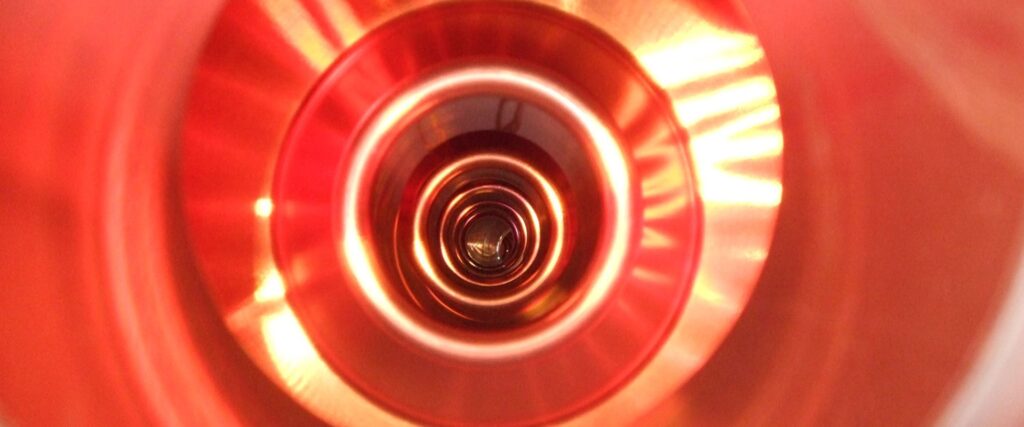Colour photograph of an inside view of a large electron positron collider cavity