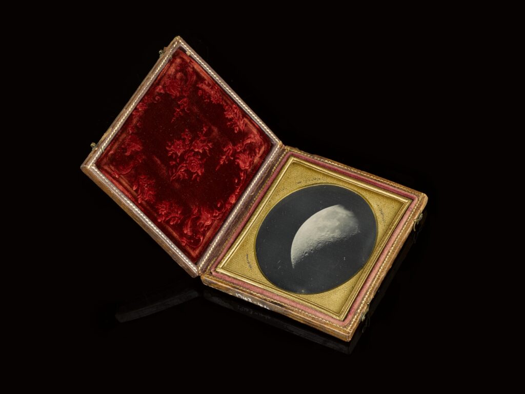 Colour photograph of a framed Daguerreotype of the Moon