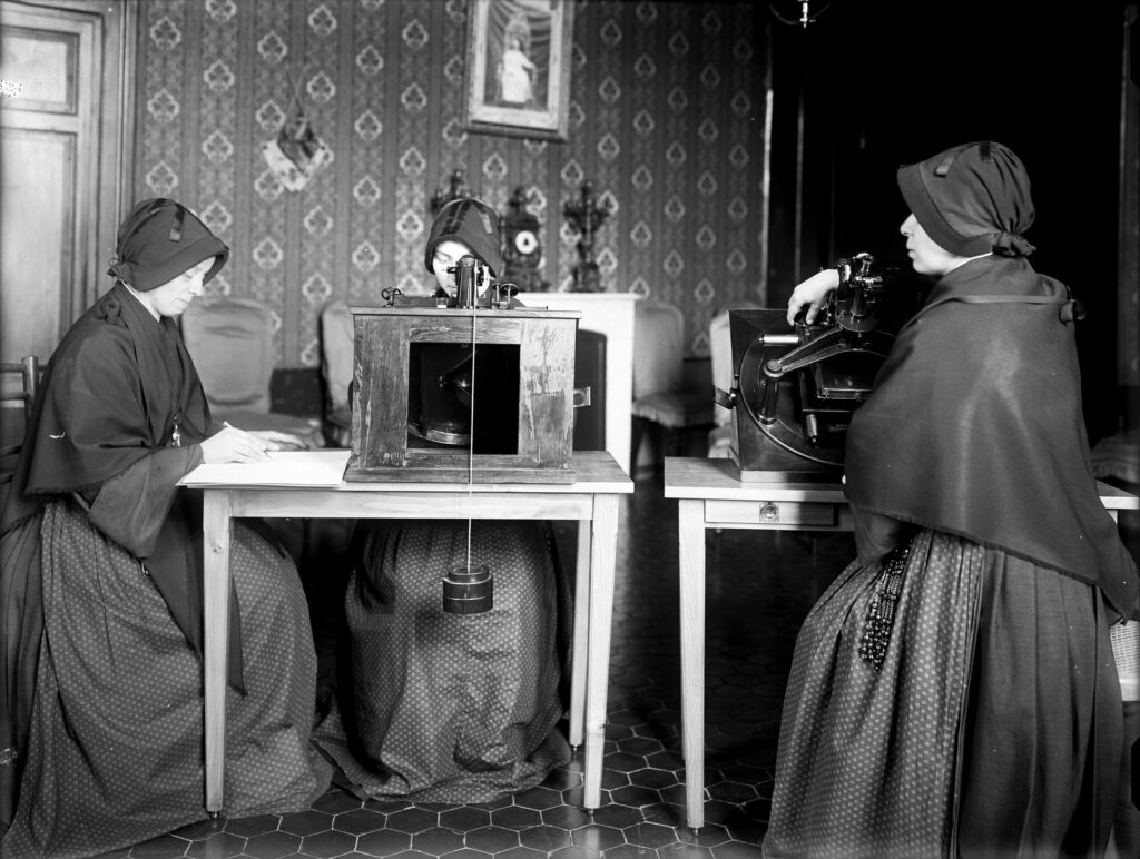 Photograph of three nuns working at the Vatican Observatory