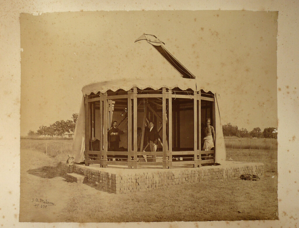 Sepia photograph of Tacchini preparing the instruments in Muddapur