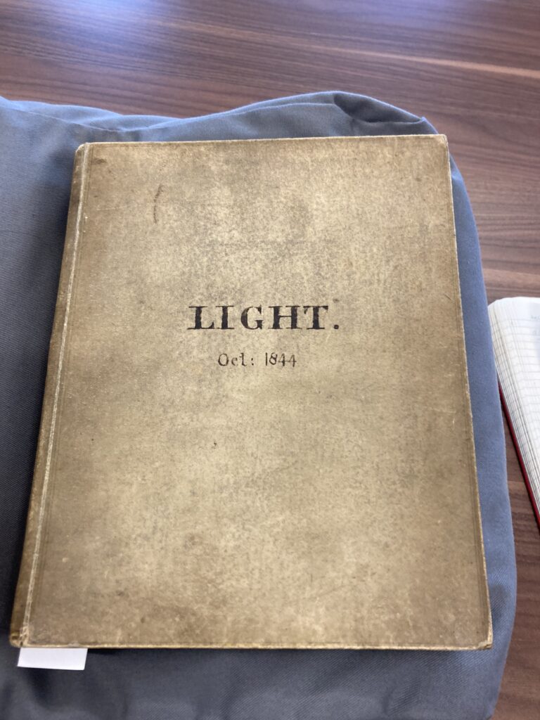 Photograph of a notebook titled Light