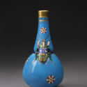 Colour photograph of a porcelain vase decorated with a beetle from 1872