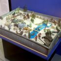 Zinc sand tray in which children would create imaginative worlds using sand and toys