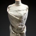Colour photograph of a canvas straitjacket for restraining adult patients