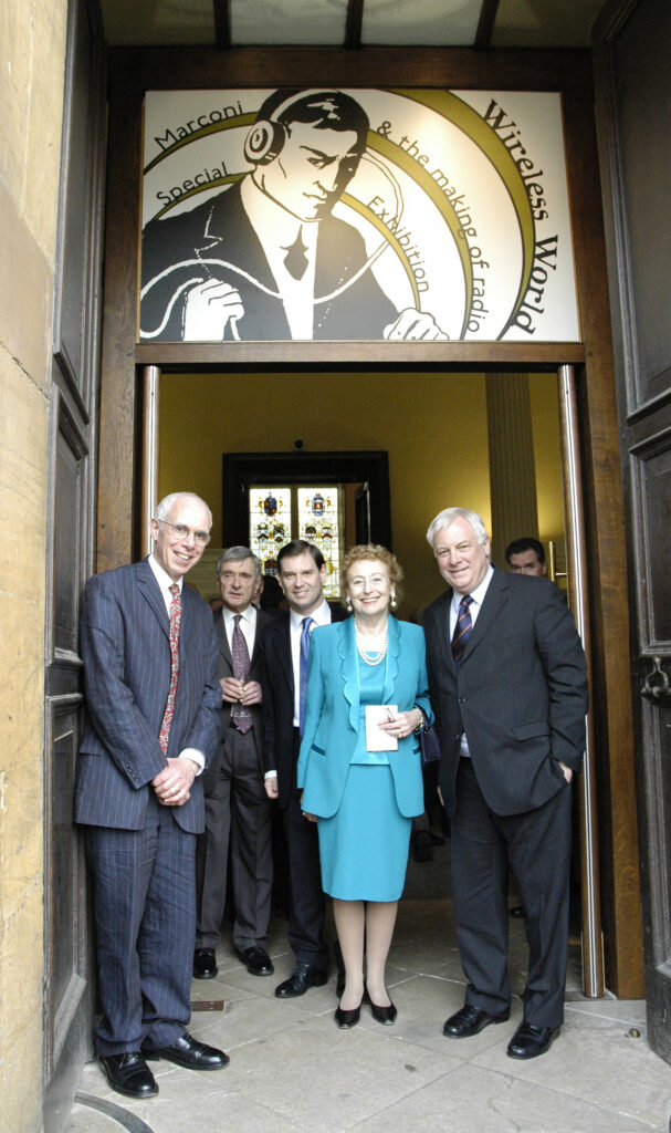 Colour photograph of Jim Bennet with colleagues at the opening of Wireless World exhibition