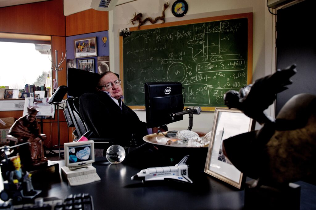 Colour photograph of Stephen Hawking in his office