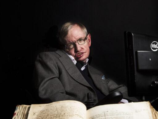 Stephen Hawking with an original book by Isaac Newton