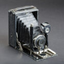 Image of an old-fashioned camera, which has its own attached camera box.