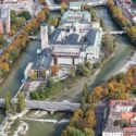 Museum from above, with river Isar on both sides. The surrounding trees are autumnal.