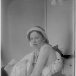 Old black and white photograph of a young woman as a patient in a hospital for treating sufferers of tuberculosis