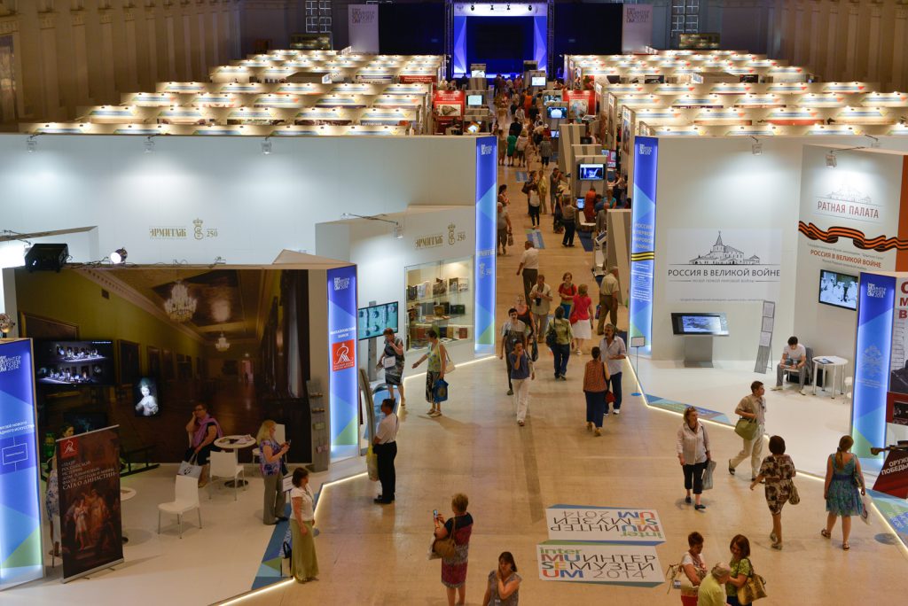 Colour photograph from high elevation of the Intermuseum conference showing a number of conference stalls