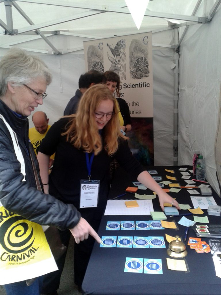 Colour photograph of the medical history card game being demonstrated