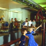 Colour photograph of museum goers at an exhibition about nature and knowledge