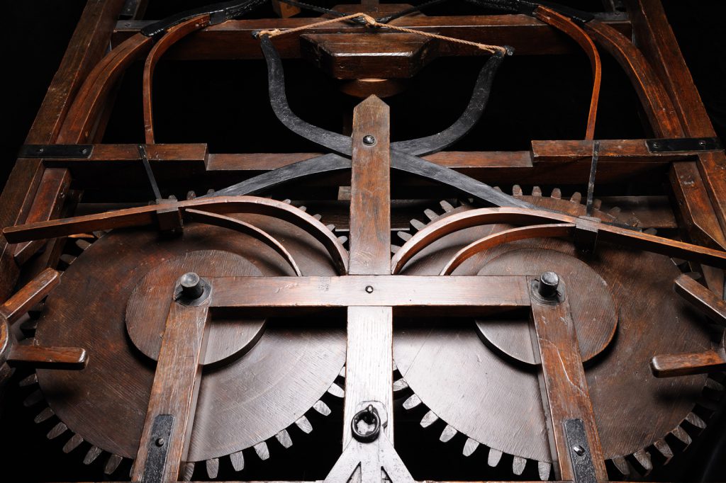 Colour photograph of the detailed workings of a wooden model of a self propelled car